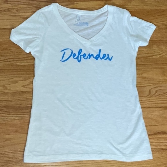 DEFEND Innocence Tee - Picture 1 of 6